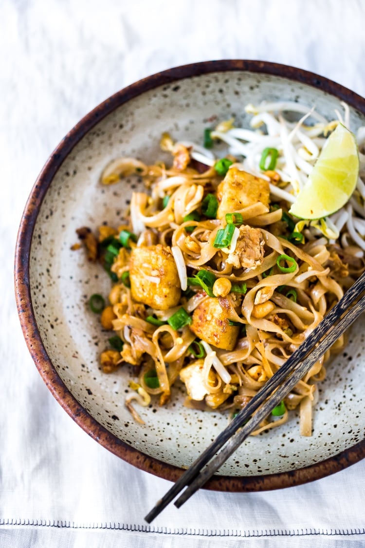 20 Best Thai Recipes!| PAD THAI- an easy, authentic recipe with made with accessible ingredients that can be made with chicken or tofu! Gluten free, Vegan adaptable with Incredible flavor ! | #authenticpadthai #easypadthai #padthai #padthainoodles www.feastingathome.com