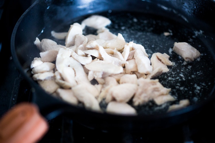 chicken breast poaching in water.
