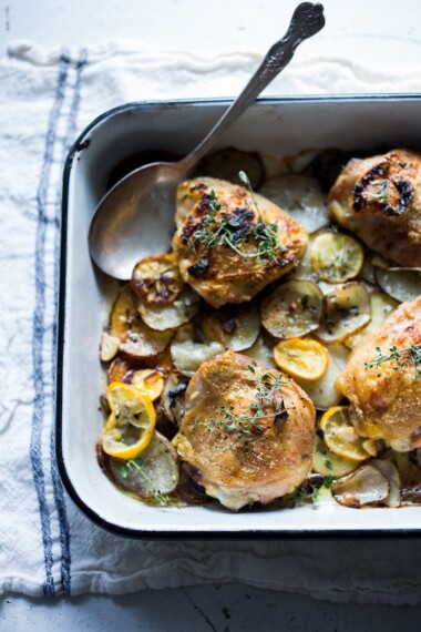 Roasted Chicken Thighs with Lemon, Thyme and Crispy Potatoes. An easy flavorful dinner with just 10 minutes of prep time, before baking in the oven. 