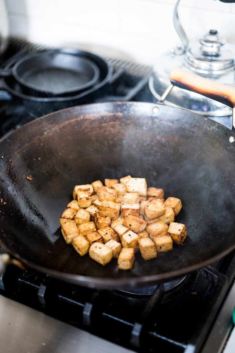 crispy tofu in a wok.