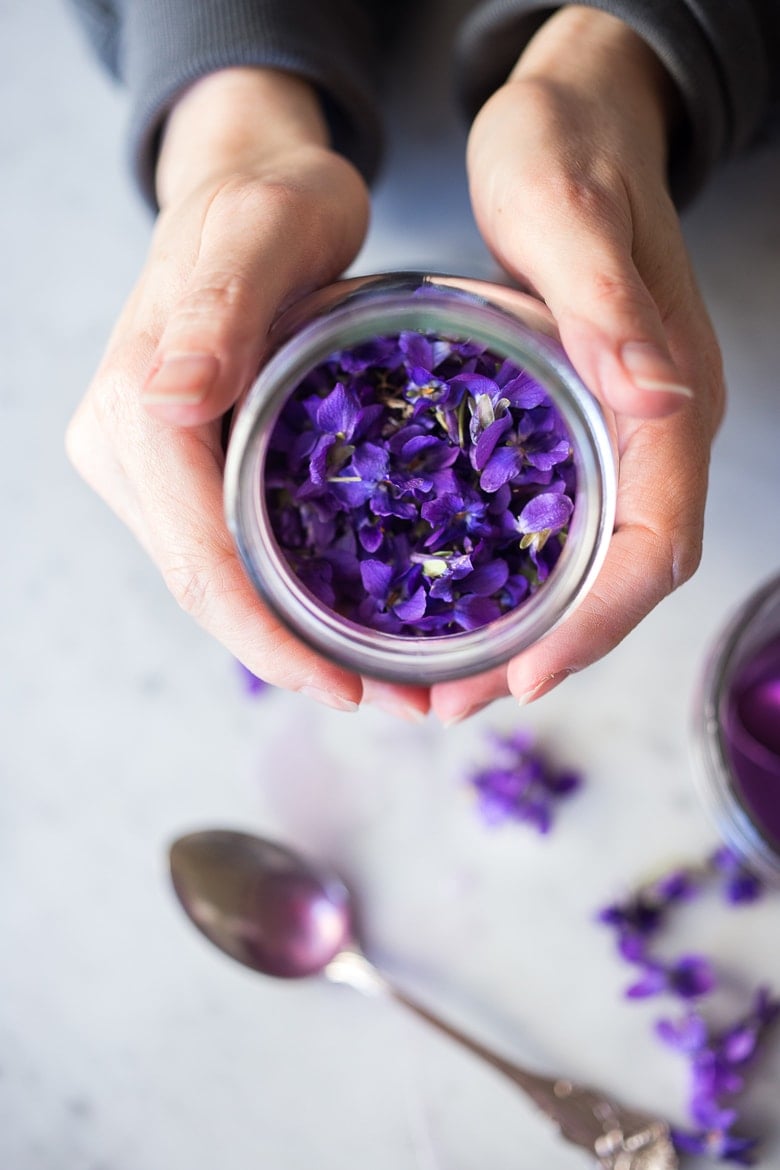 An easy recipe for Violet Simple Syrup- lovely in cocktails like a Violet infused French 75 - perfect for Mothers Day, Bridal Showers or Weddings. Romantic, floral, feminine. | www.feastingathome.com