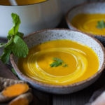A simple recipe for Glowing Carrot Ginger Soup with turmeric and Coconut Milk is light, luscious, earthy and flavorful. Fresh turmeric root gives it a hint of the exotic.