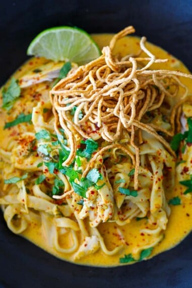 Khao Soi recipe in a black bowl.