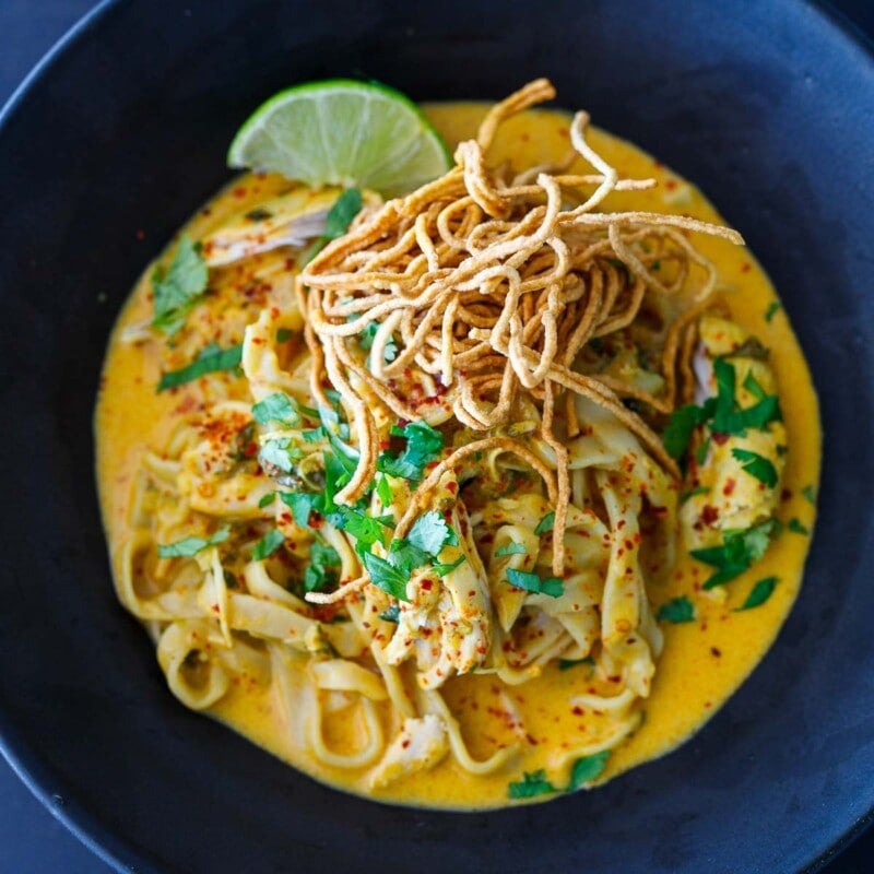 Khao Soi recipe in a black bowl.