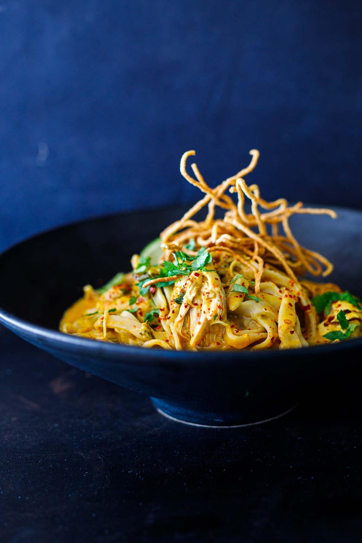 This Khao Soi recipe is rich, fragrant and delicious! It's a Coconut Curry Noodle Soup that hails from Northern Thailand and can be made with chicken, shrimp, tofu, or our crispy tofu.  Vegan-adaptable, GF.  Watch the Video!