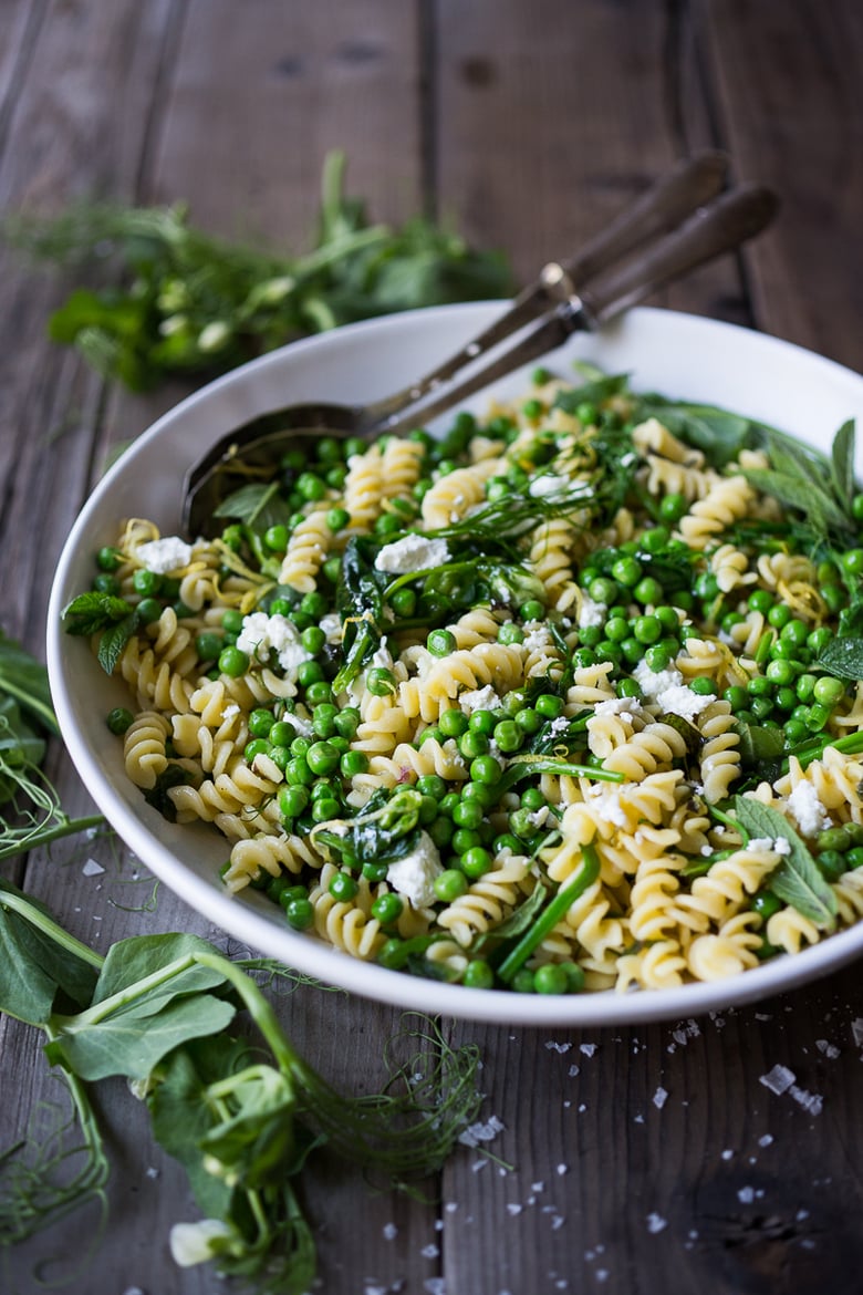 A delicious seasonal recipe for Spring Pea Pasta with truffle oil, lemon and mint. Flavorful and simple to make, this can be served warm or chilled. | www.feastingathome.com