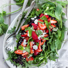 Strawberry Arugula salad with basil, black rice and goat cheese