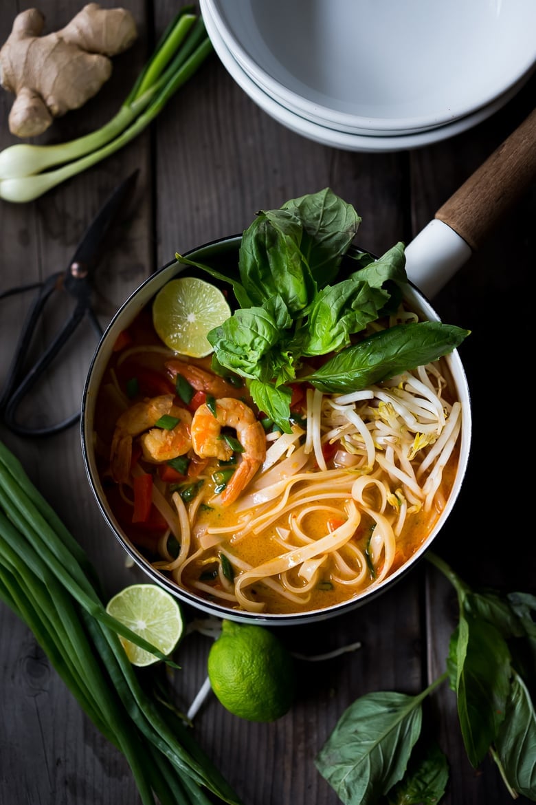 Fast and flavorful, this 15 Minute Northern Style, Thai Coconut Noodle Soup called, Khao Soi is so easy to make! A rich fragrant broth w/ either shrimp, tofu or chicken. | www.feastingathome.com