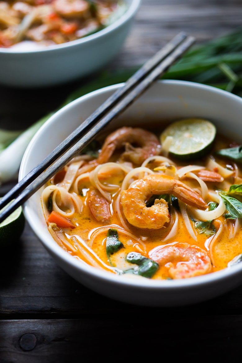 20 Easy Thai Recipes ! Thai Coconut Curry Noodle Soup is FAST, FLAVORFUL & so EASY! A rich fragrant broth w/ either shrimp, tofu or chicken. | www.feastingathome.com #currynoodles #noodle #soup #thai #thaisoup #noodlesoup