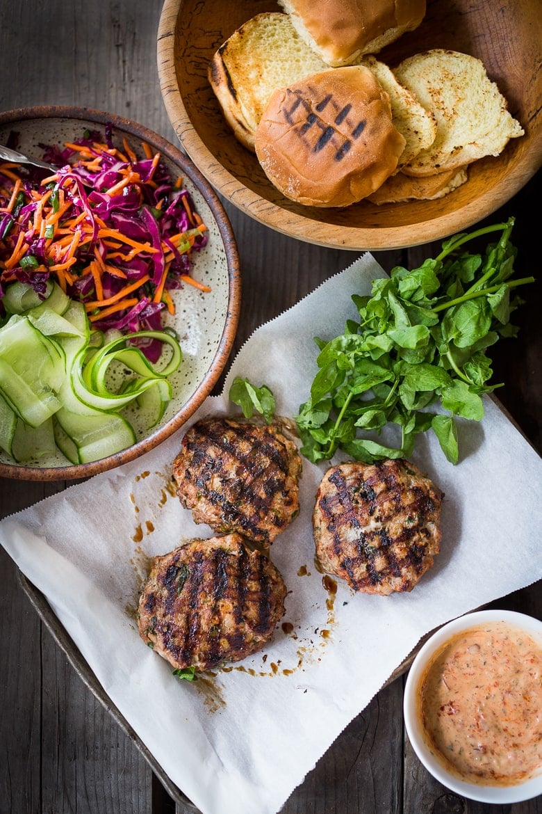 Thai Turkey Burgers- with lemongrass, ginger & basil, topped w/ a Crunchy Asian Slaw and Spicy Aioli. Light, healthy, FLAVORFUL! Easy to make. | www.feastingathome.com #thaiturkeyburger #thaiburger #turkeyburger