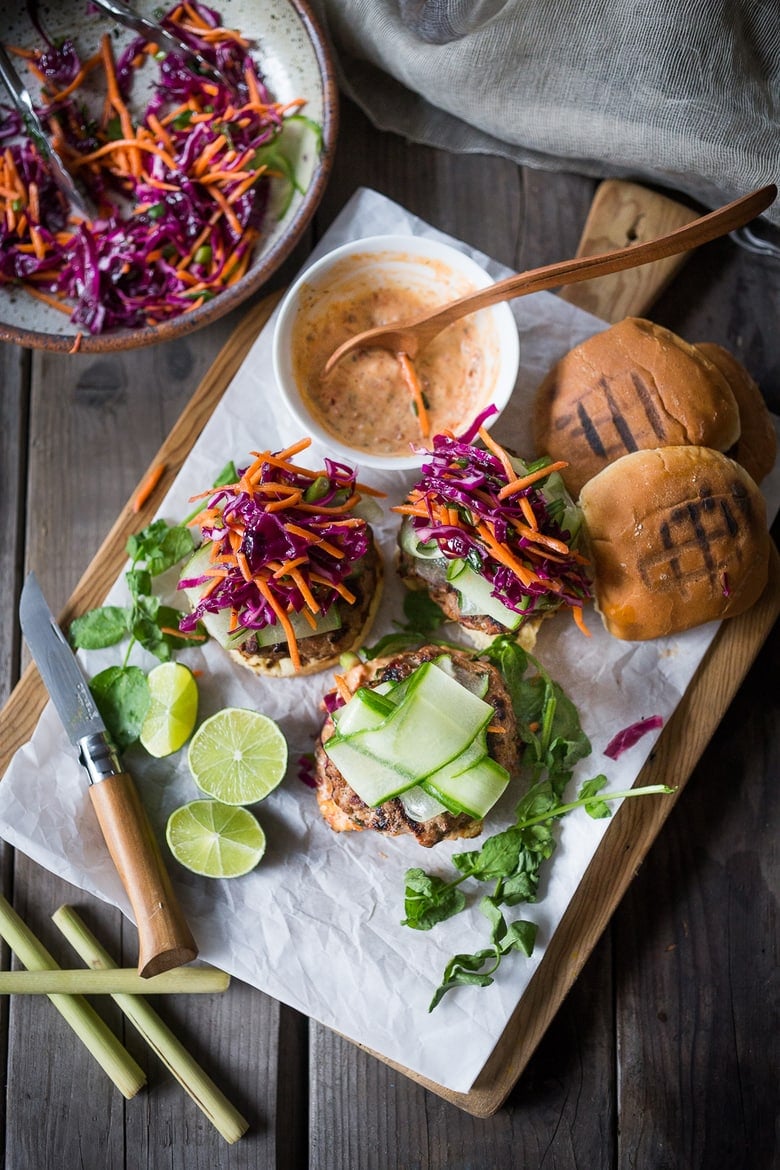 Thai Turkey Burgers- with lemongrass, ginger & basil, topped w/ a Crunchy Asian Slaw and Spicy Aioli. Light, healthy, FLAVORFUL! Easy to make. | www.feastingathome.com #thaiturkeyburger #thaiburger #turkeyburger