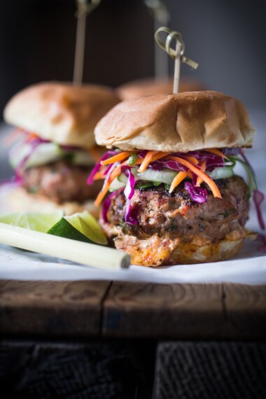 Thai Burgers with Ground turkey, Asian Slaw, Cucumber Ribbons & Spicy Chili Aioli. Light, healthy, Delicious! Easy to make. | www.feastingathome.com #thaiturkeyburger #thaiburger #turkeyburger #asianslaw #carrotslaw #healthyburger