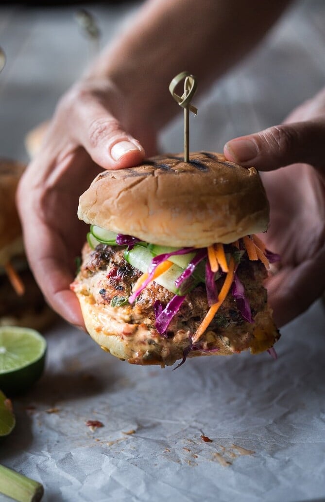 Thai Turkey Burger Recipe This healthy turkey burger recipe bursts with irresistible Thai flavor! Cook them on the grill, on the stovetop, or in your air fryer, then top with fresh and crunchy Asian slaw, cucumber ribbons, and sriracha aioli. Gluten-free, made without bread crumbs. Video. Serve with Sweet Potato Fries.