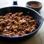 A simple and delicious recipe for Turkey Chorizo - a lightened up version of our favorite Mexican sausage. Can be made in 15 minutes! | www.feastingathome.com