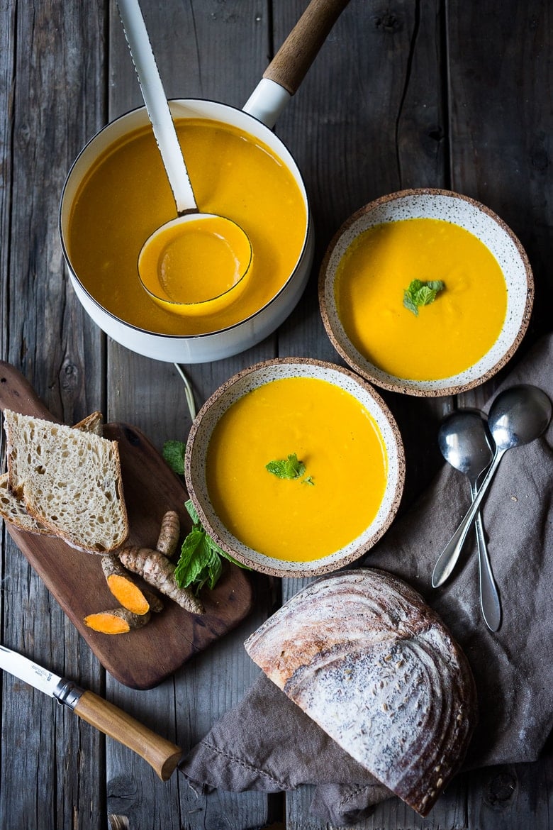 10 Simple Powerful Turmeric Recipes to Heal, Sooth and Protect | Add fresh turmeric to soups, like this Glowing Carrot, turmeric and ginger soup. | www.feastingathome.com