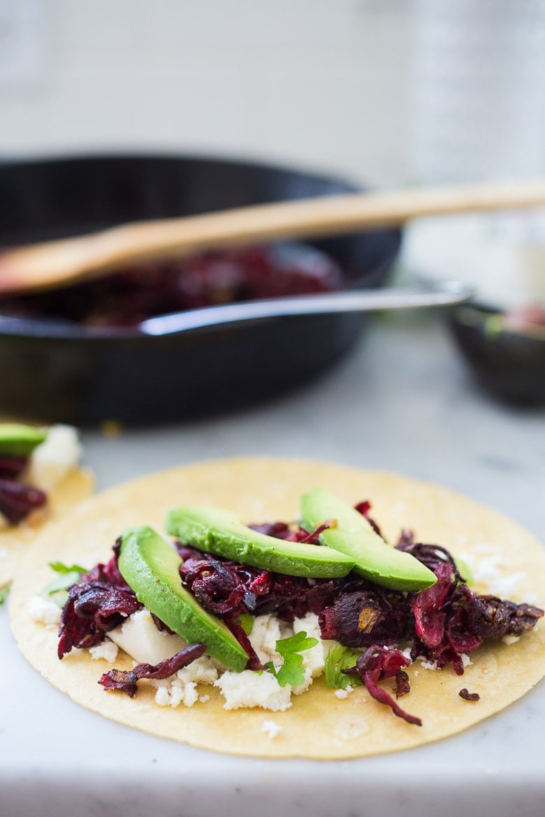 Vegetarian Hibiscus Flower Quesadillas- so "meaty" and delicious, the flowers are sauted with onion and garlic and add great texture and flavor! | www.feastingathome.com