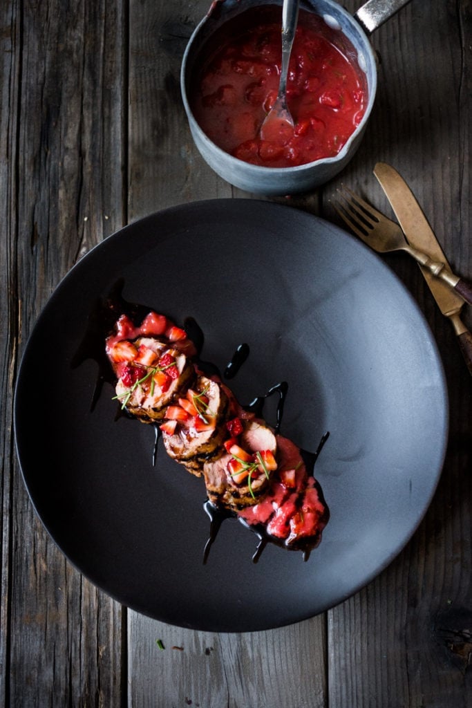grilled pork loin with strawberry compote and a drizzle of balsamic glaze.