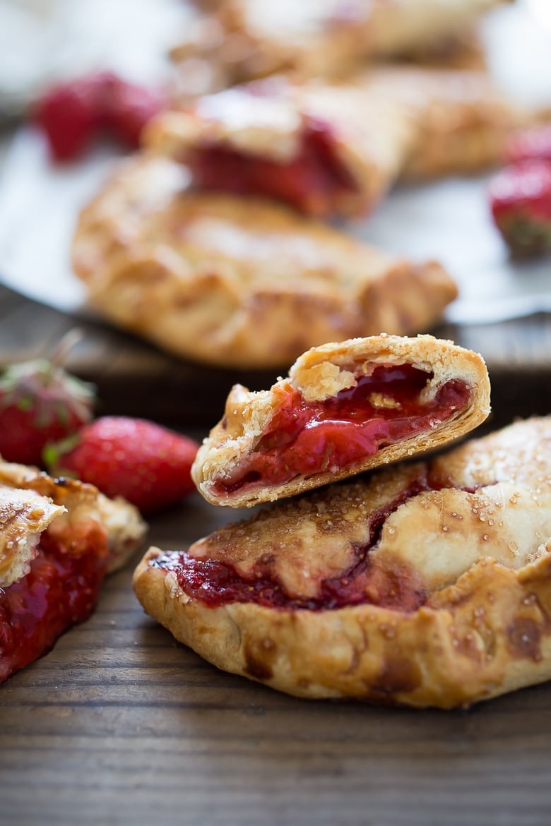 These little Strawberry Hand Pies, or Strawberry Turnovers if you prefer --are like summer wrapped up in buttery pie crust. They are packable and transportable-- perfect for picnics and summer barbecues when you don't want to deal with dessert plates and forks. Simply pick them up and eat them.
