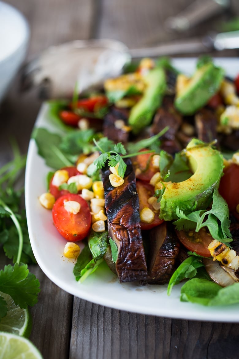 30 Summer Dinners for Hot Days! This Grilled Portobello Salad with Avocado, Tomatoes, Corn and a Smoky Lime Dressing  is vegan and low in carbs. A delicious summer salad for grilling weather!  