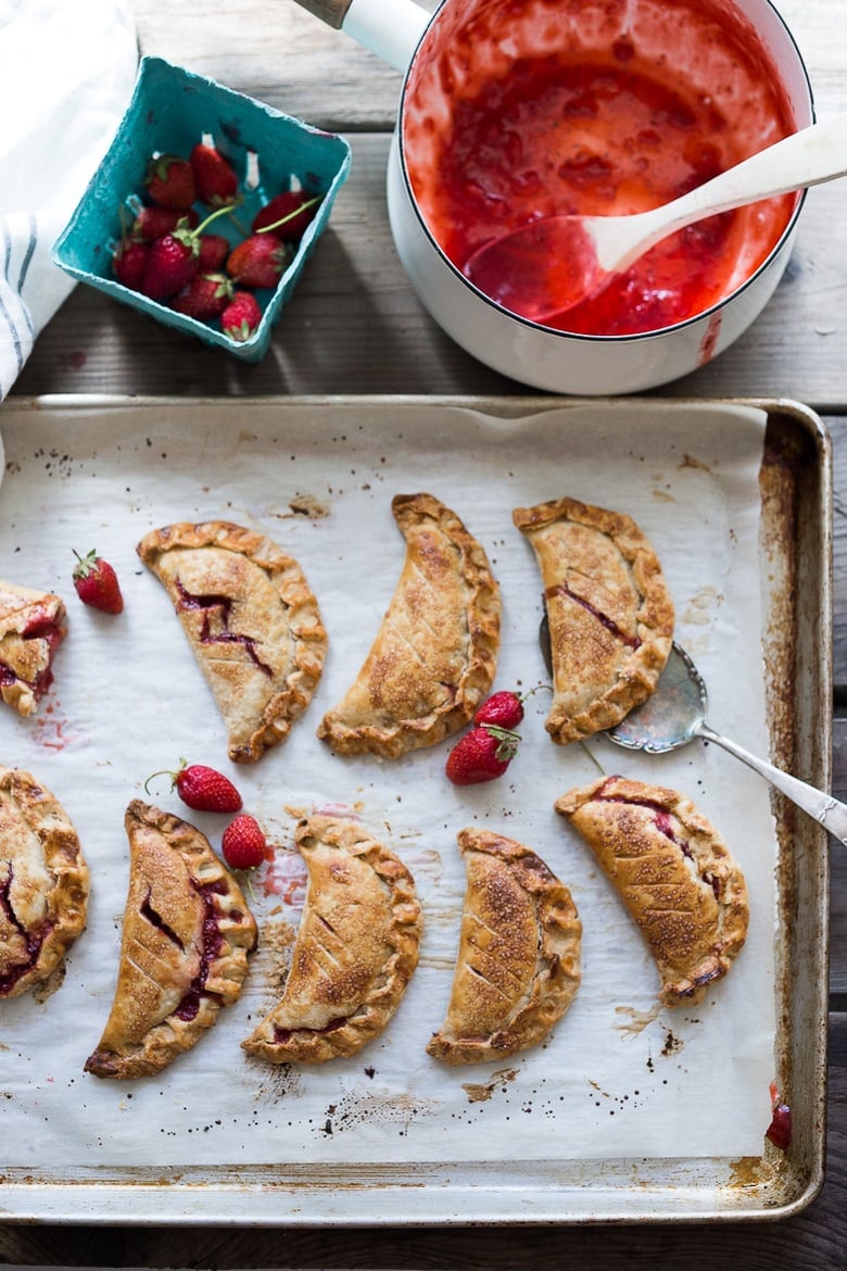 A simple delicious recipe for Strawberry Turnovers (aka "Hand Pies") sweetened with maple syrup! #turnovers #turnoverrecipe #handpies #strawberryrecipes www.feastingathome.com