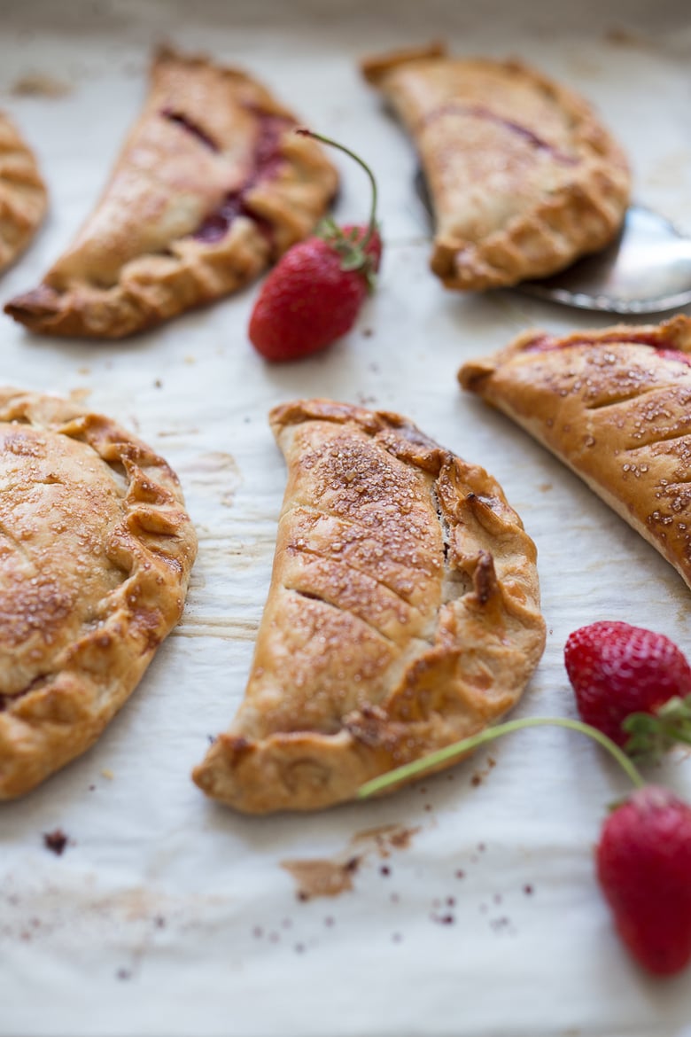 A simple delicious recipe for Strawberry Turnovers (aka "Hand Pies") sweetened with maple syrup! #turnovers #turnoverrecipe #handpies #strawberryrecipes www.feastingathome.com