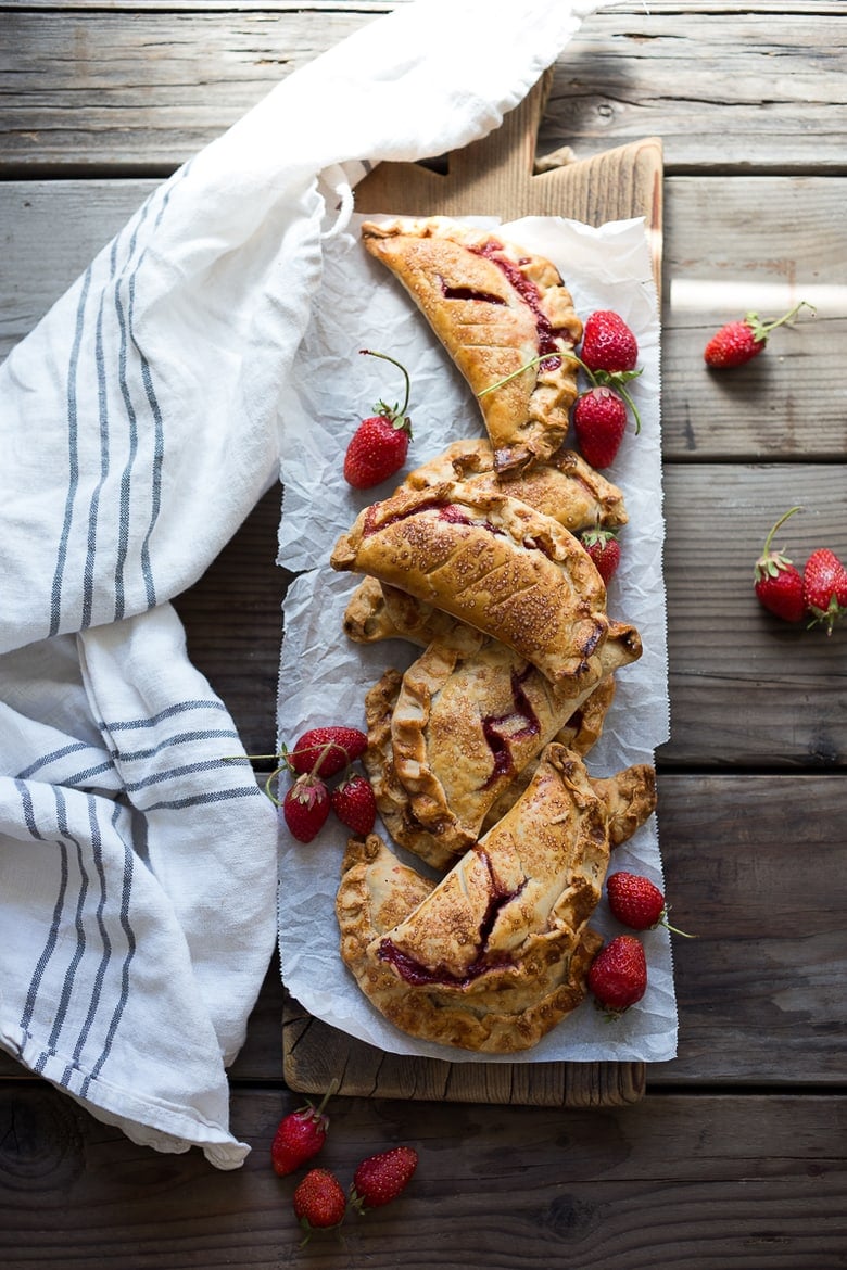 A simple delicious recipe for Strawberry Turnovers (aka "Hand Pies") sweetened with maple syrup! #turnovers #turnoverrecipe #handpies #strawberryrecipes www.feastingathome.com