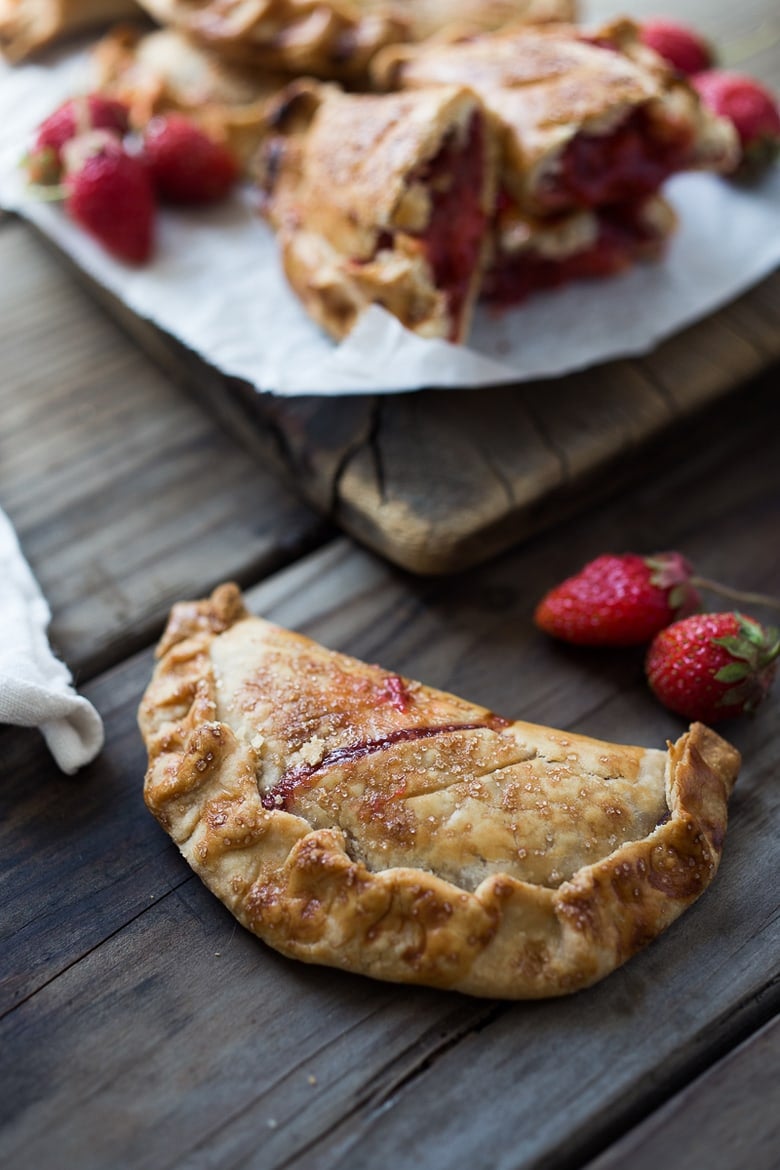 A simple delicious recipe for Strawberry Turnovers (aka "Hand Pies") sweetened with maple syrup! #turnovers #turnoverrecipe #handpies #strawberryrecipes www.feastingathome.com