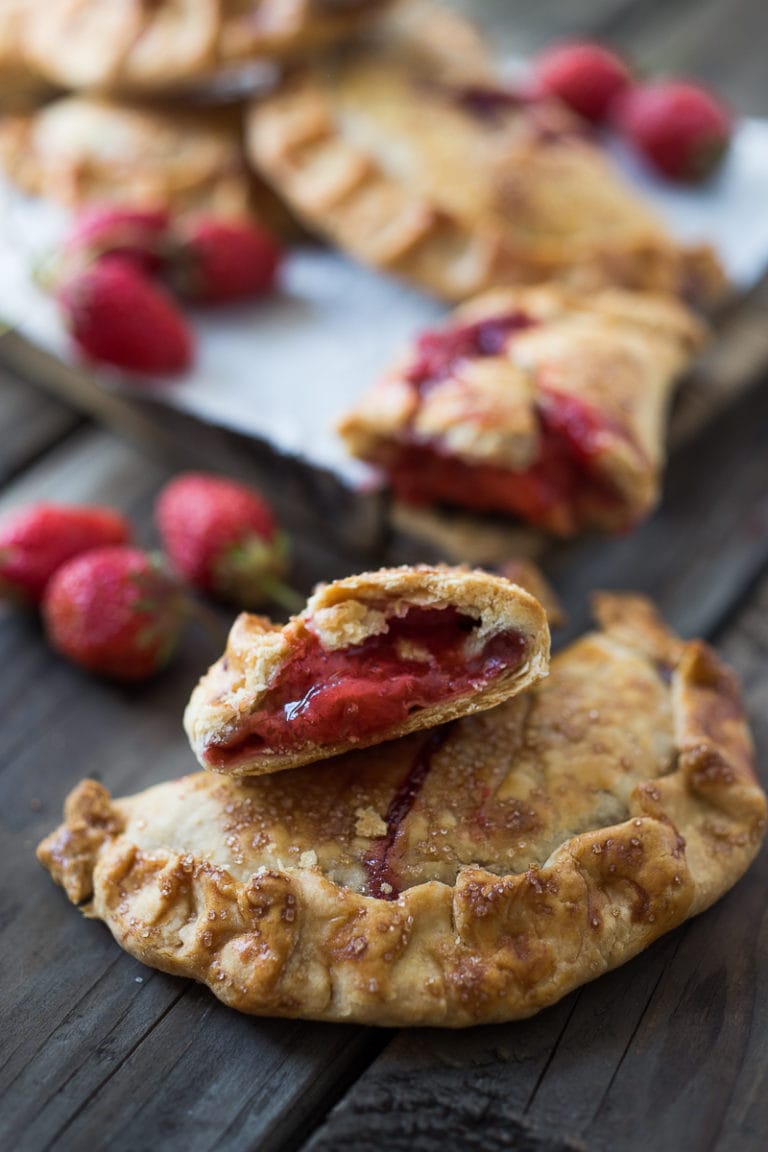 A simple delicious recipe for Strawberry Turnovers (aka "Hand Pies") sweetened with maple syrup! #turnovers #turnoverrecipe #handpies #strawberryrecipes www.feastingathome.com