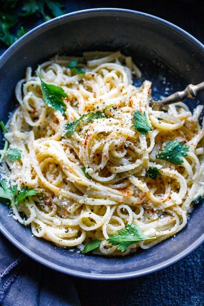 A simple, delicious recipe for Cacio e Pepe - a fast and flavorful- four-ingredient pasta recipe that can be topped with your favorite seasonal veggie (or protein!).