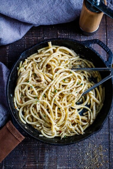 A simple, delicious recipe for Cacio e Pepe - a fast and flavorful- four-ingredient pasta recipe that can be tossed with your favorite seasonal veggie and made in 20 minutes! 