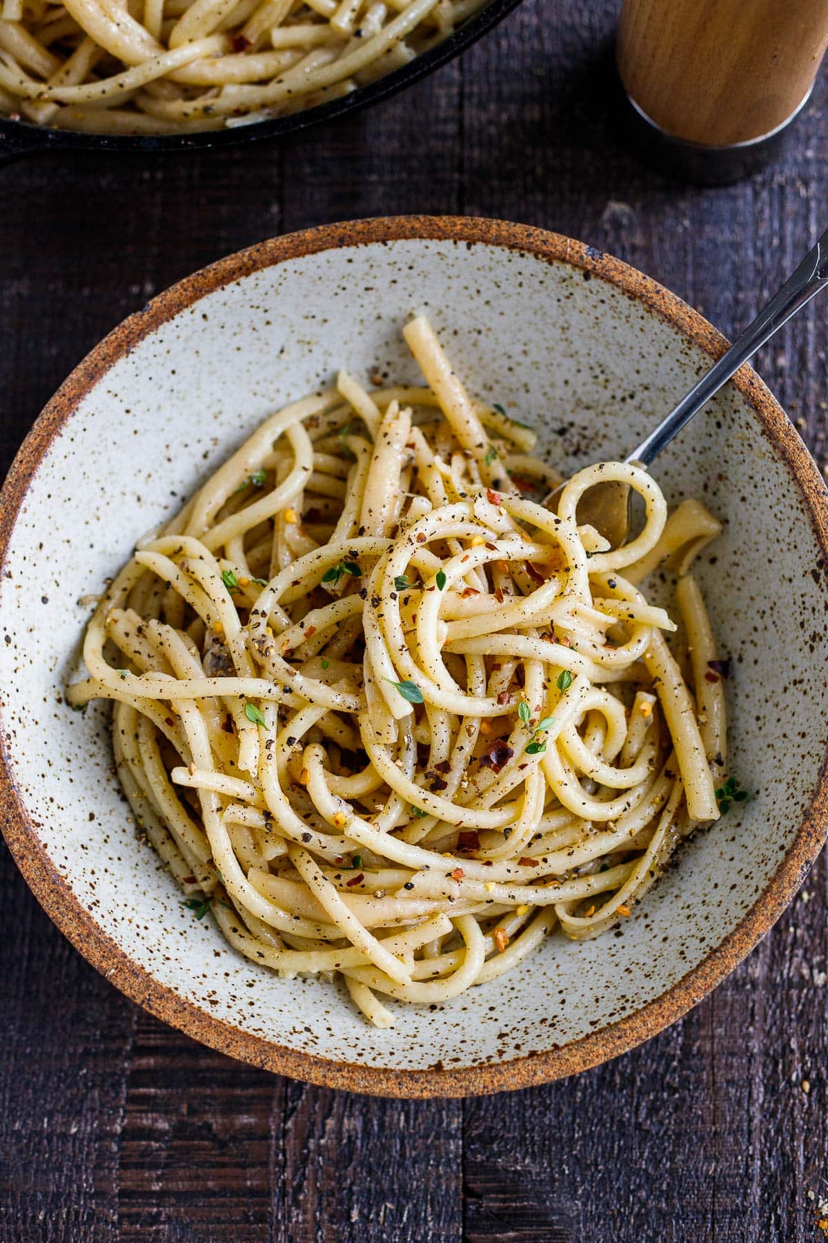 A simple, delicious recipe for Cacio e Pepe - a fast and flavorful- four-ingredient pasta recipe that can be topped with your favorite seasonal veggie (or protein!).