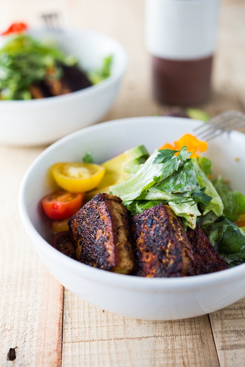 Vegan Ceasar Salad with Blackened Cajun Tofu dressed in a creamy caesar dressing  that is dairy-free, nut-free and low in calories! #vegancaesar #vegancaesardressing #vegansalad 