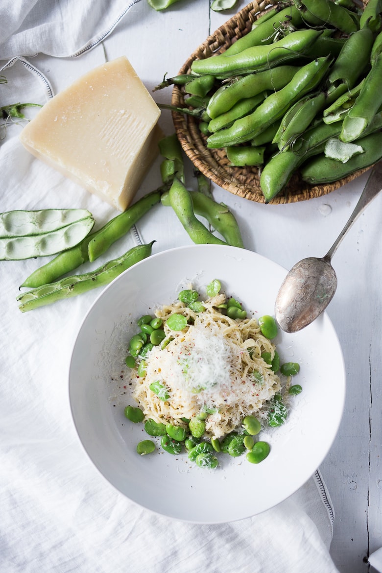 A simple delicious recipe for Cacio e Pepe with Fava Beans (Pasta with fava beans, cheese and pepper) is so tasty you will want to make it over and over. No fava beans? Substitute peas or edamame! | www.feastingathome.com