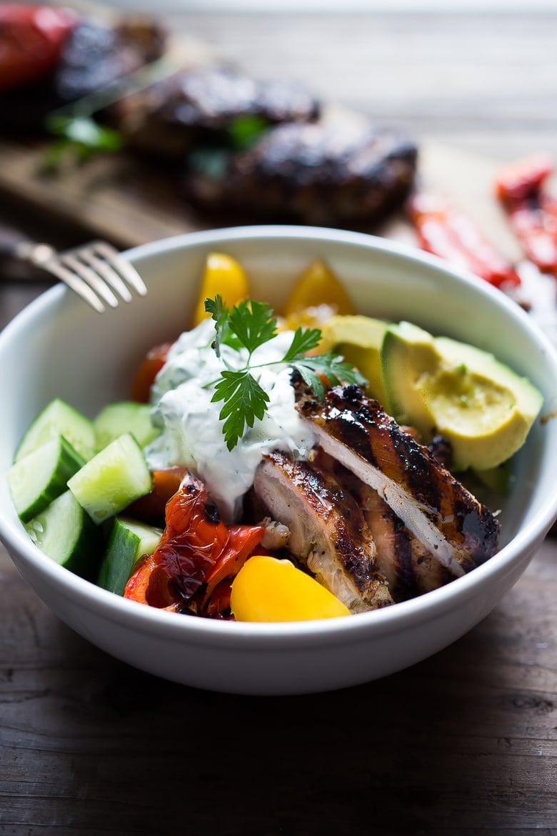 A simple tasty recipe for Grilled Greek Souvlaki Bowl with Cauliflower Rice, flavorful Cucumber Yogurt Sauce and fresh summer vegetables. This can be made with Grilled Chicken or Grilled Portobellos! | www.feastingathome.com