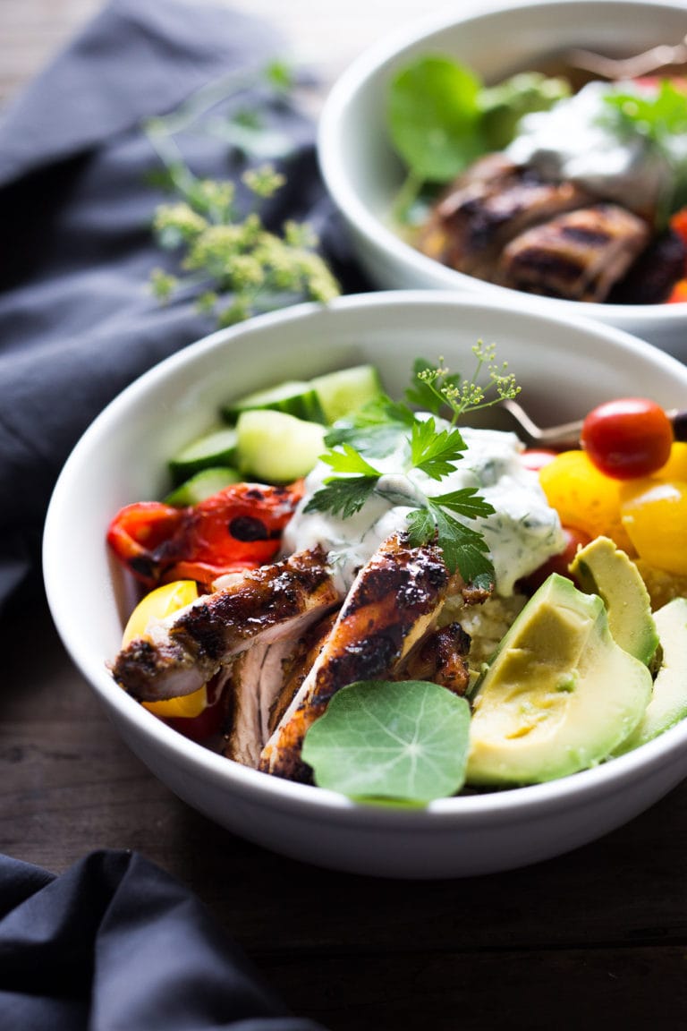 Chicken Souvlaki Bowls are light, healthy, and full of lovely Greek flavor. Loaded up with veggies, and piled over cauliflower rice, this meal is low in carbs but high in deliciousness. Vegetarian Adaptable!