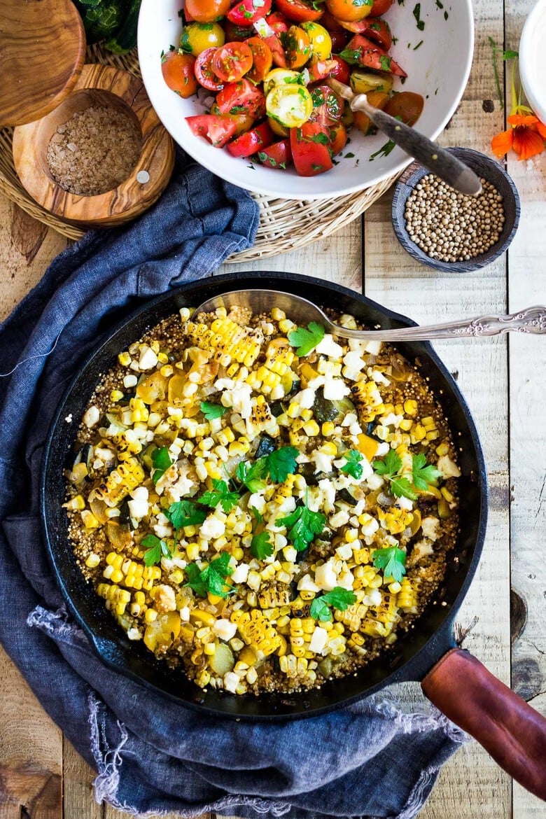 Baked Quinoa with Zucchini, Corn and feta, topped with a fresh Tomato Relish. A healthy, easy vegetarian dinner recipe, perfect for summer! #bakedquinoa #quinoabake #corn #zucchinirecipes 