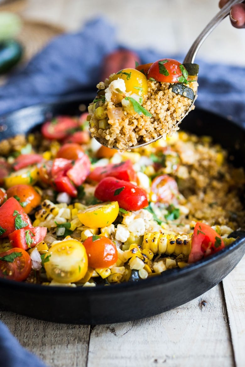 Our best Zucchini Recipes: Baked Quinoa with Zucchini, Corn and feta, topped with a fresh Tomato Relish. A healthy, easy vegetarian dinner recipe, perfect for summer! #bakedquinoa #quinoabake #corn #zucchinirecipes