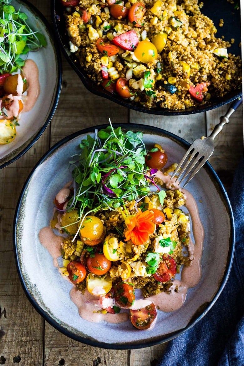 Baked Quinoa with Zucchini, Corn and feta, topped with a fresh Tomato Relish. A healthy, easy vegetarian dinner recipe, perfect for summer! #bakedquinoa #quinoabake #corn #zucchinirecipes 