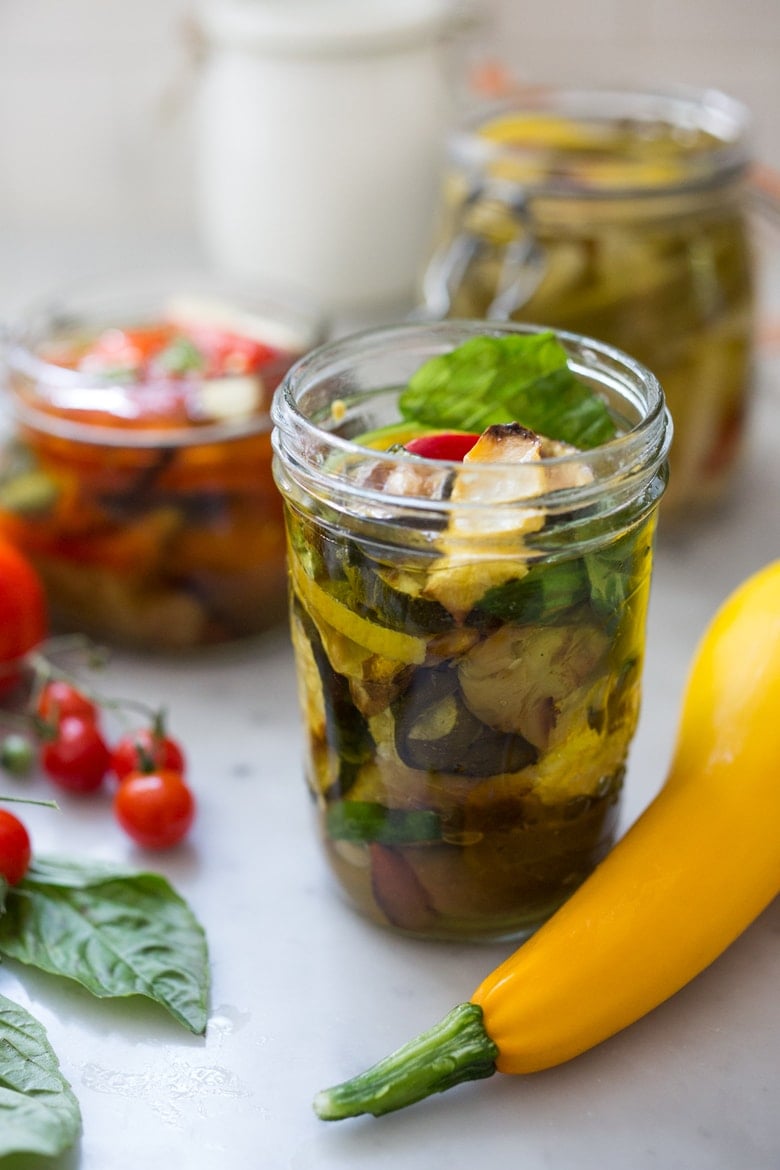 Quick Marinated Veggies! Extend summer's bounty by Preserving Veggies in Olive Oil- serve with Cheese or Charcuterie boards and Mezze Platters. Delicious, quick & simple! | www.feastingathome.com