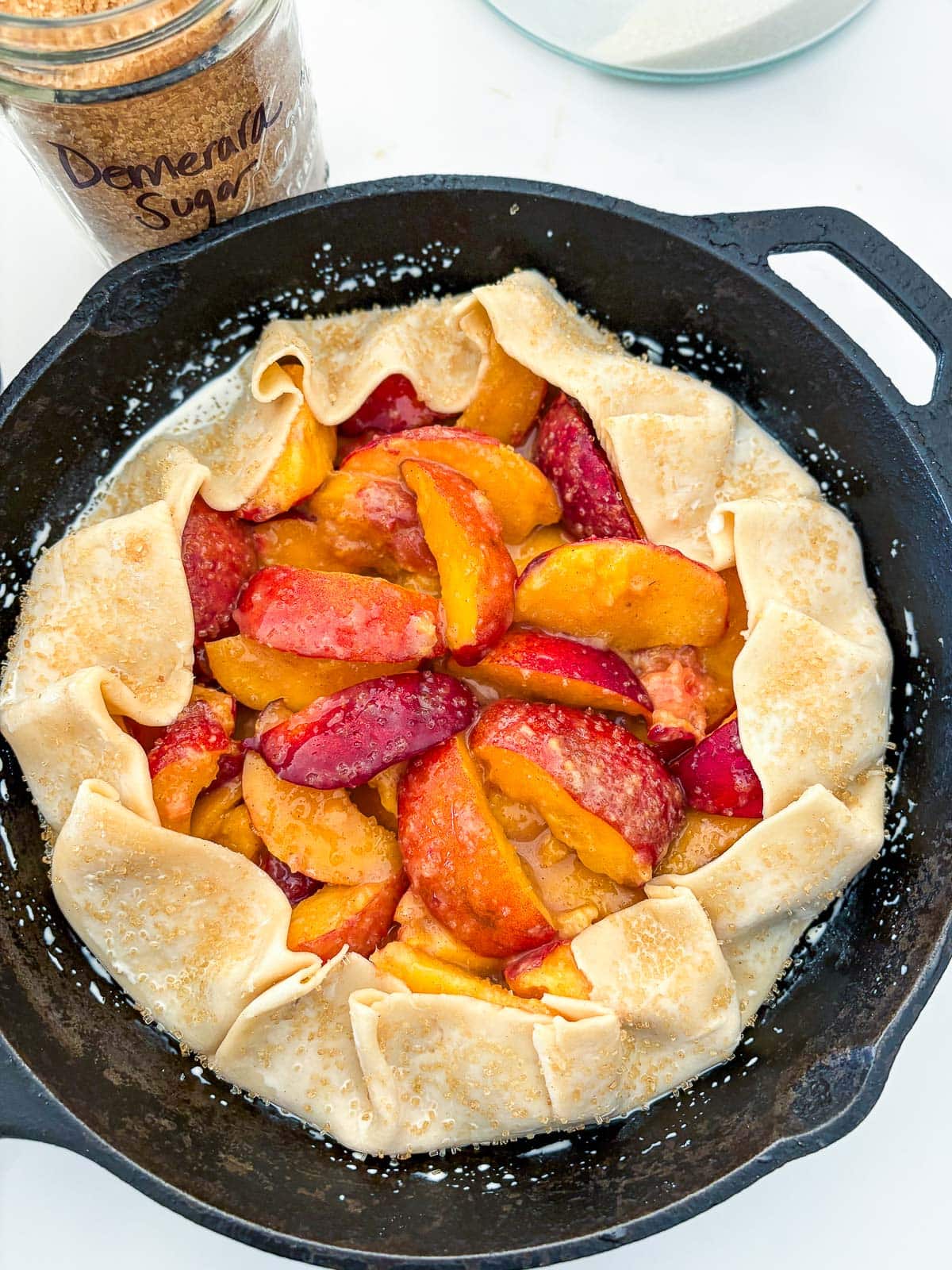unbaked peach pie in a skillet.