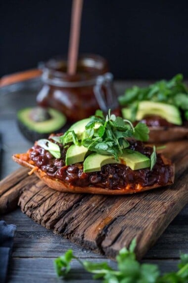 These BBQ Stuffed Sweet Potatoes are stuffed with bbq style blackbeans, optional chicken, melty cheese, avocado and cilantro -perfect for mixed households who have meat-lovers, vegetarians, vegans, and gluten-free folks all living under the same roof. Fully customizable and vegan-adaptable! 