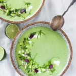 A refreshing flavorful recipe for Chilled Cucumber Soup with yogurt, cilantro, coriander and lime. Top this with shrimp or keep it vegetarian! So tasty. | www.feasingathome.com