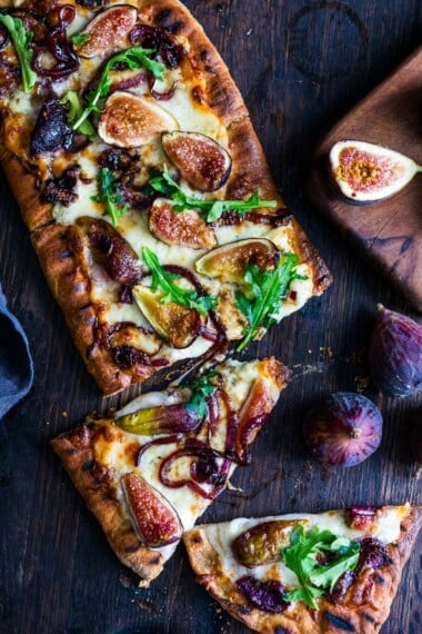 This delicious Fig Pizza with balsamic onions, creamy gorgonzola cheese, and fresh arugula is the perfect combination of flavors! Bake it or grill it, either way, you'll love this fall-inspired vegetarian pizza!