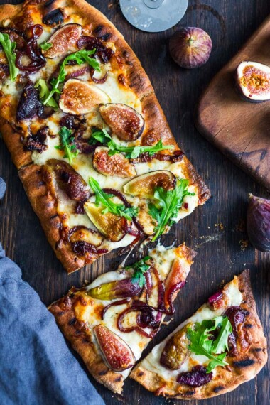 This delicious Fig Pizza with balsamic onions, creamy gorgonzola cheese, and fresh arugula is the perfect combination of flavors! Bake it or grill it, either way, you'll love this fall-inspired vegetarian pizza!