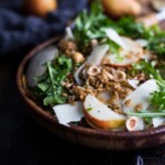 A delicious recipe for Farro Salad with pear, hazelnuts and arugula, keep it vegan or add pecorino. Either way it's a tasty fall salad!