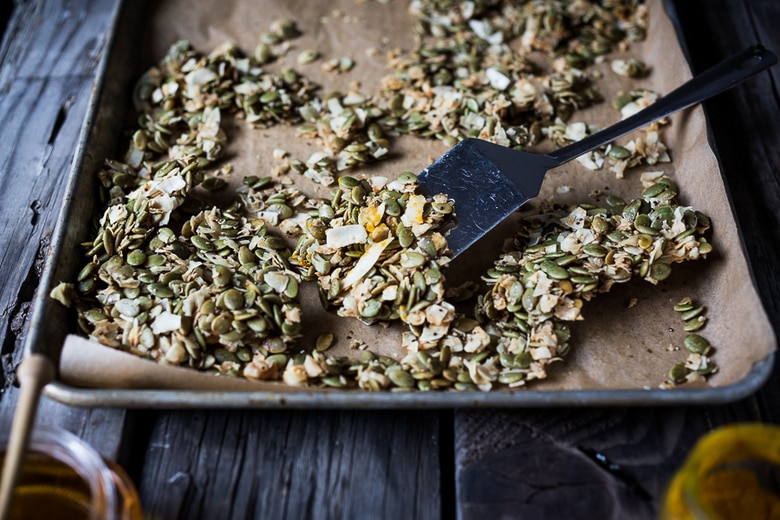 A simple recipe for Coconut Pumpkin Seed Snacks infused with lime and honey. Easy, delicious! Vegan and gluten free! | www.feastingathome.com