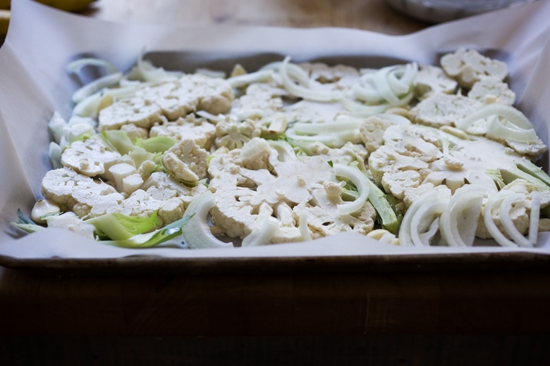 sliced cauliflower on a sheet pan. 