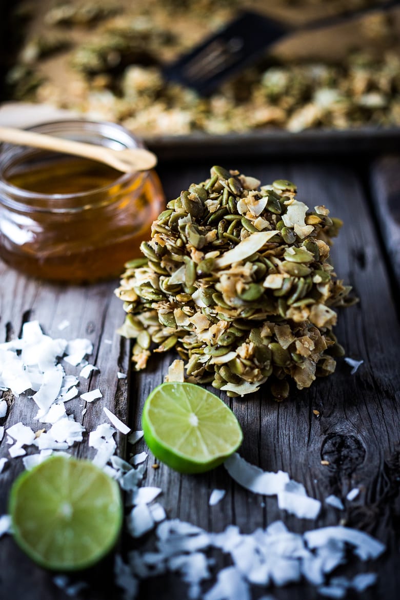 A simple recipe for Coconut Pumpkin Seed Snacks infused with lime and honey. Easy, delicious! Vegan and gluten free! | www.feastingathome.com