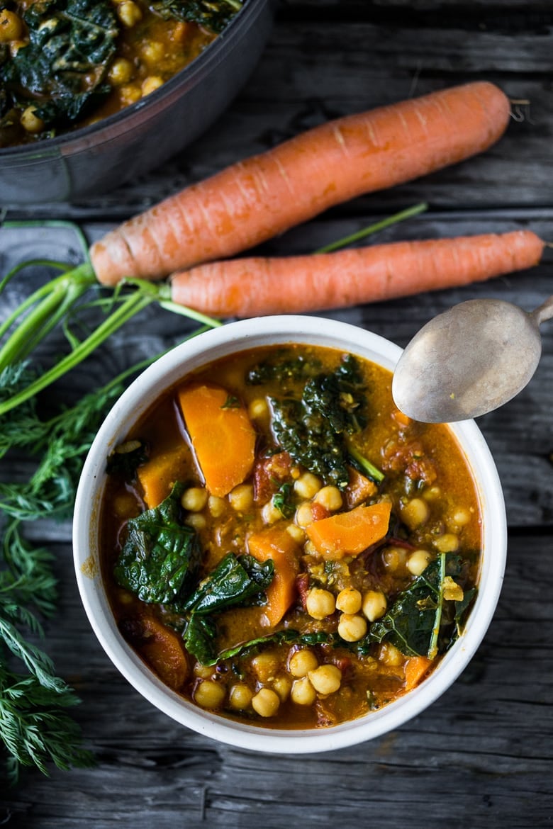 Tunisian Chickpea Stew with Carrot and tops, turmeric, kale and "quick Harissa". | www.feastingathome.com
