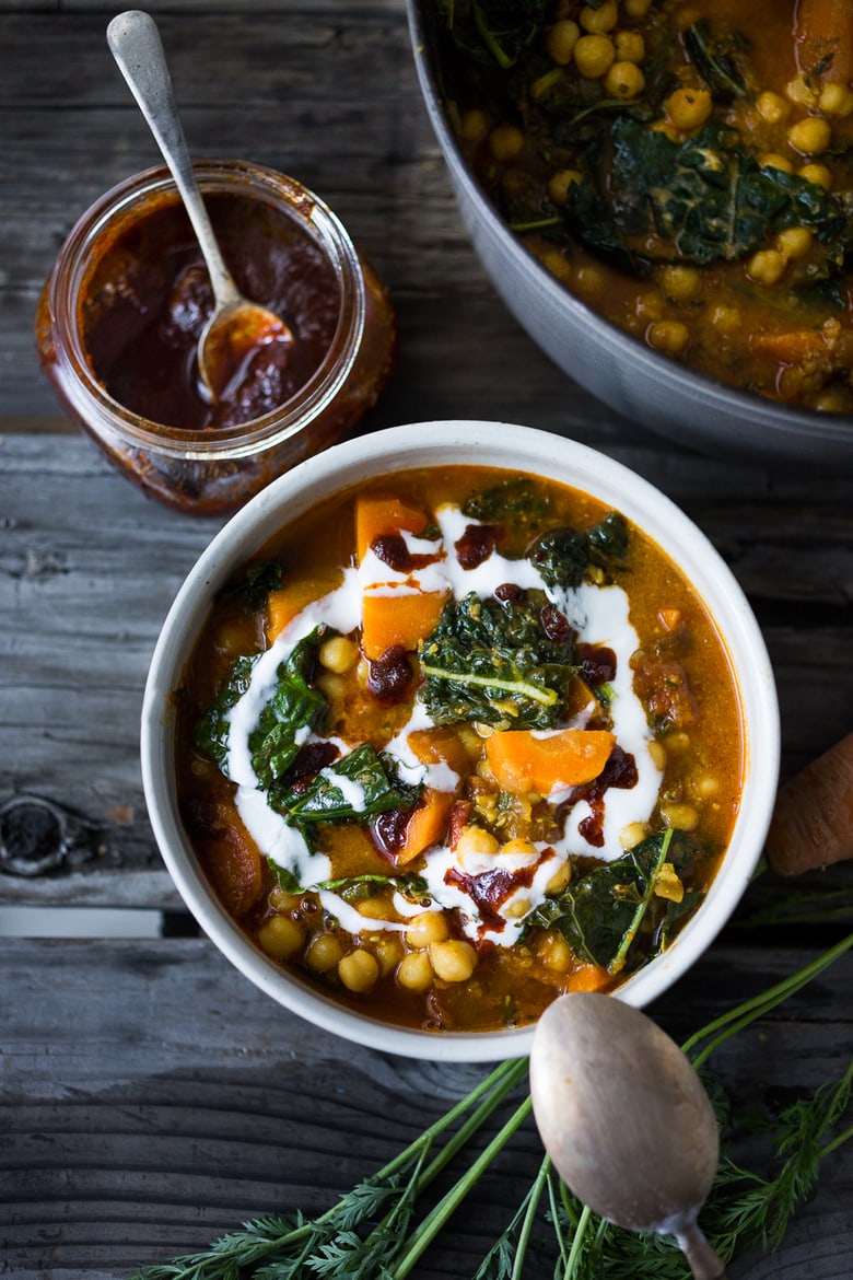 Tunisian Chickpea Stew with Carrot and tops, turmeric, kale and "quick Harissa". | www.feastingathome.com